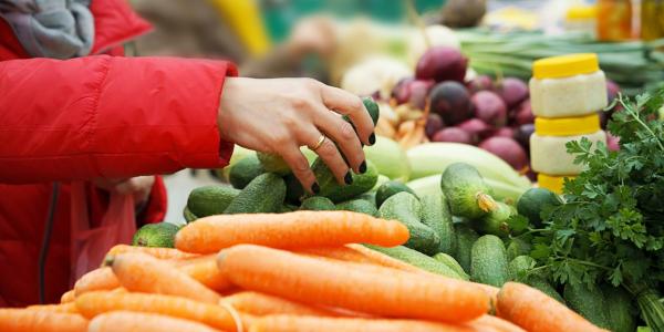 person shopping for produce