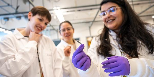 Dr. Alannah Hallas speaks with graduate students. Photo credit: Paul Joseph.